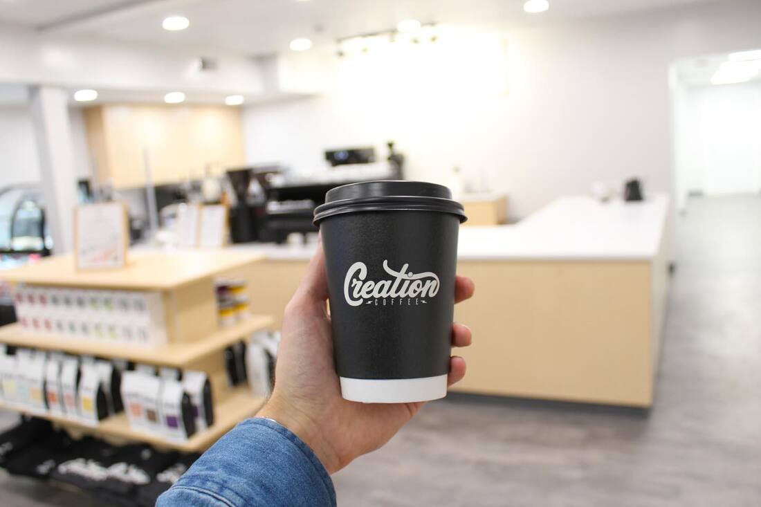 Creation Coffee to-go cup